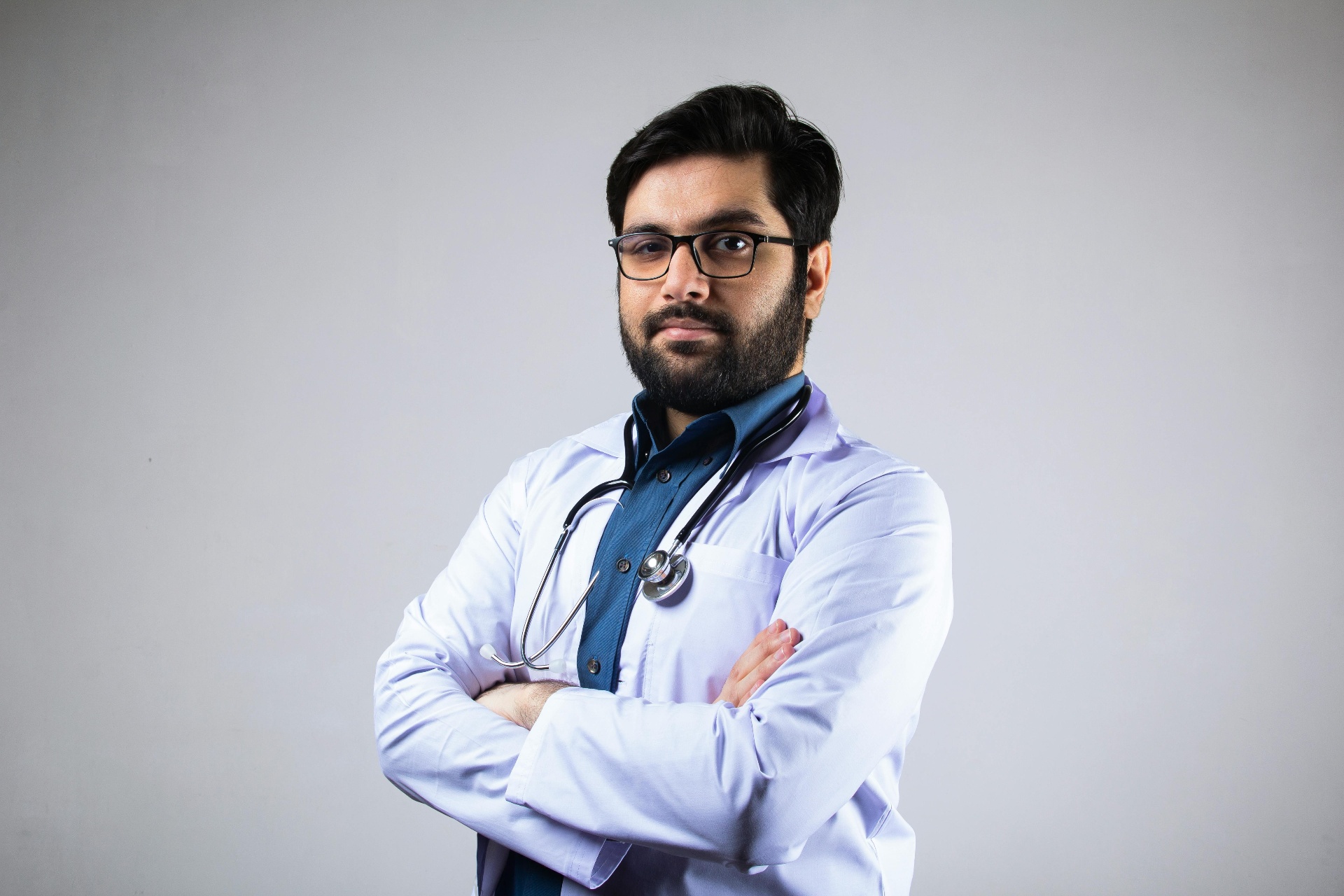 Indian family consulting doctor on phone